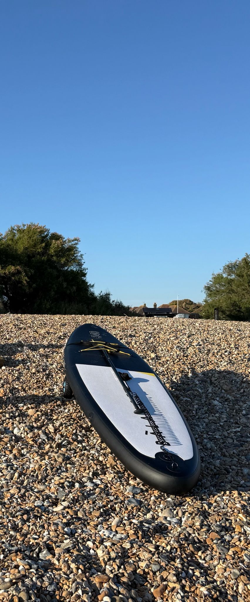 Paddleboards ready at the water, ideal for exploring the coastline.